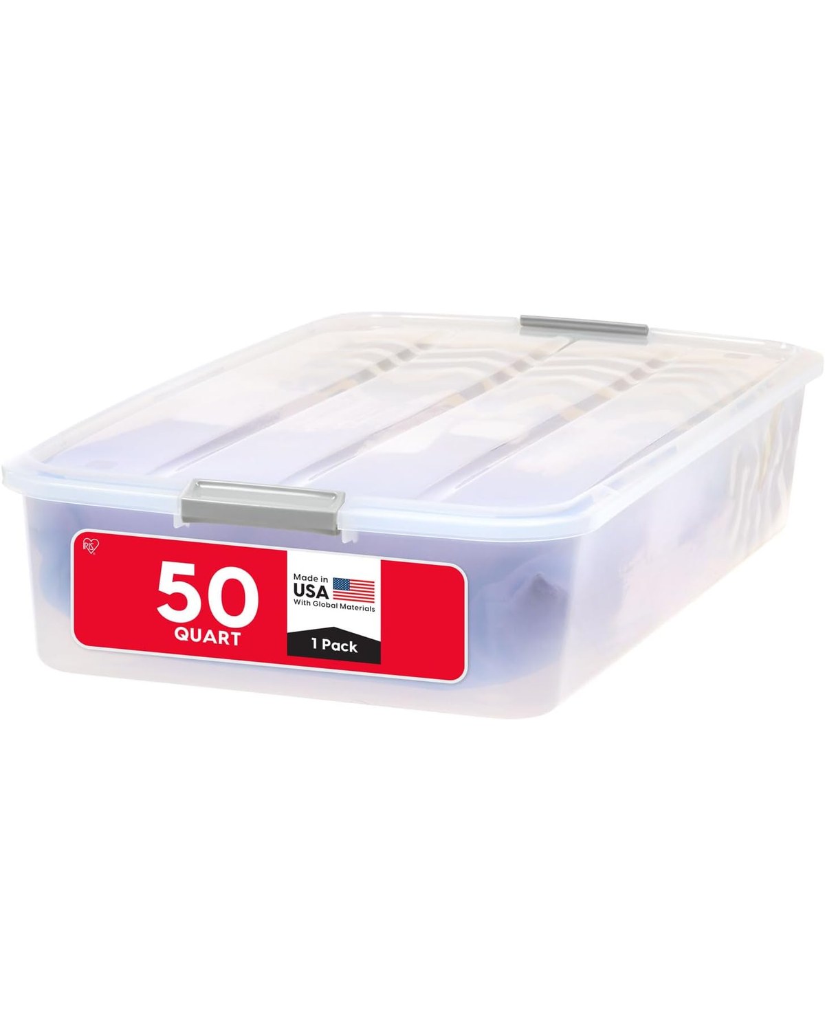 A clear plastic under-bed storage drawer partially pulled out from beneath a lofted dorm bed, revealing neatly folded out-of-season clothes and extra bedding inside.