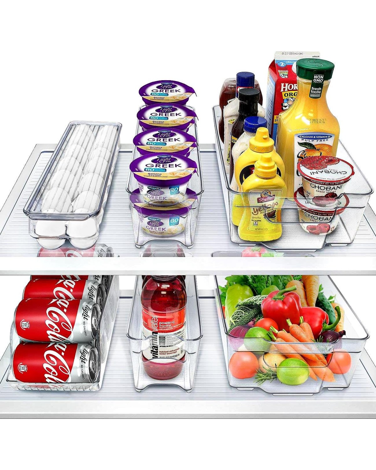 An open refrigerator showing six clear stackable BPA-free fridge bins organizing produce in the crisper zone, condiments on the door, and snacks on the main shelf.