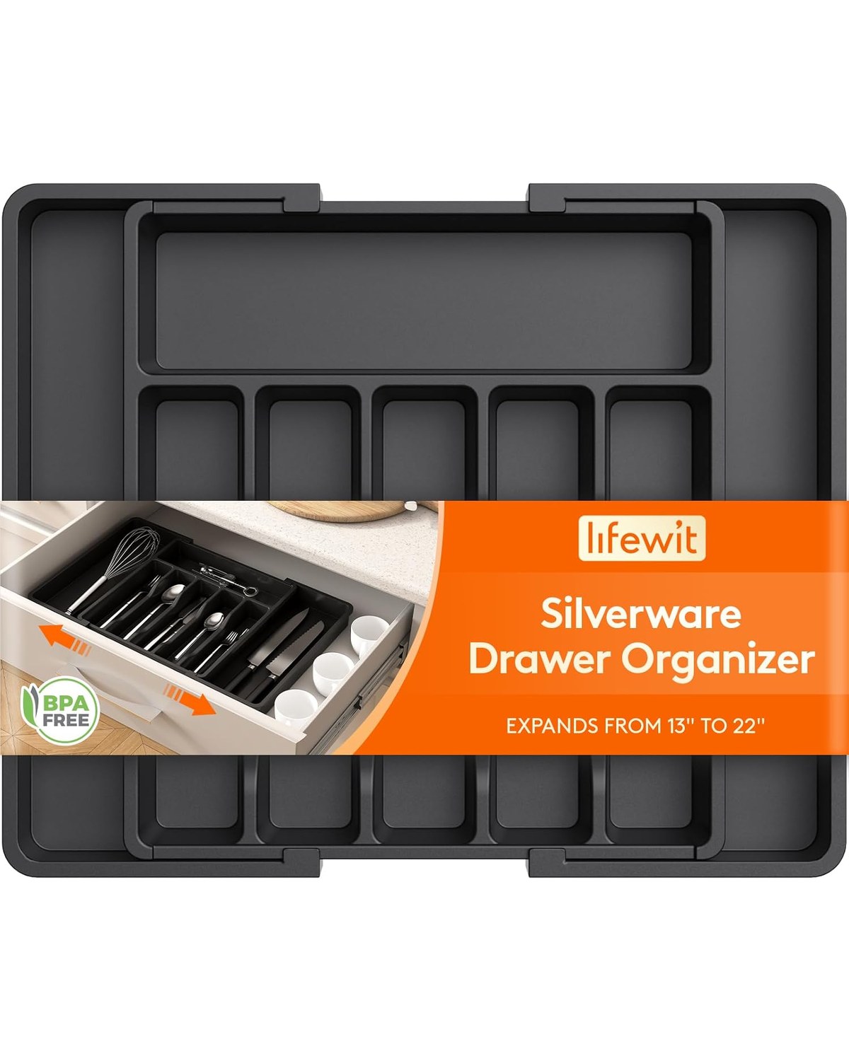 A cream expandable drawer divider tray in an open kitchen drawer, neatly separating forks, knives, spoons, and serving utensils in distinct compartments.