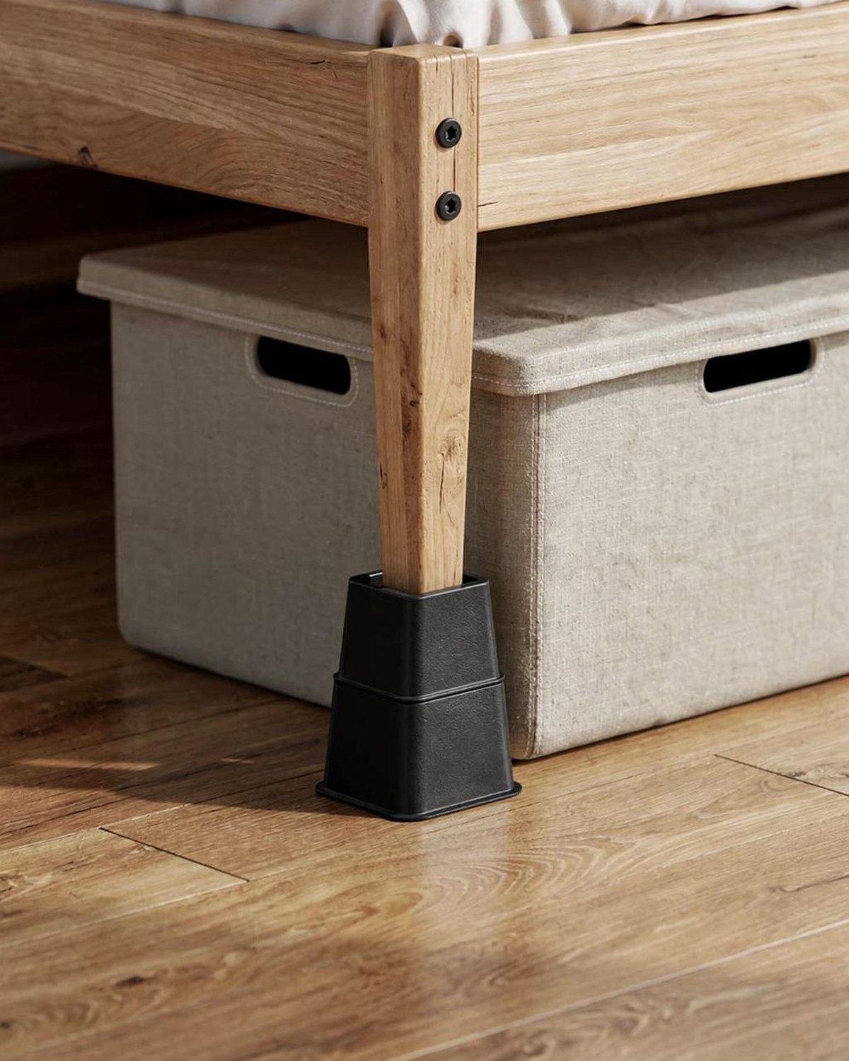 Four stackable black bed-riser blocks lifting a bed leg, shown both at 3-inch and 5-inch heights.